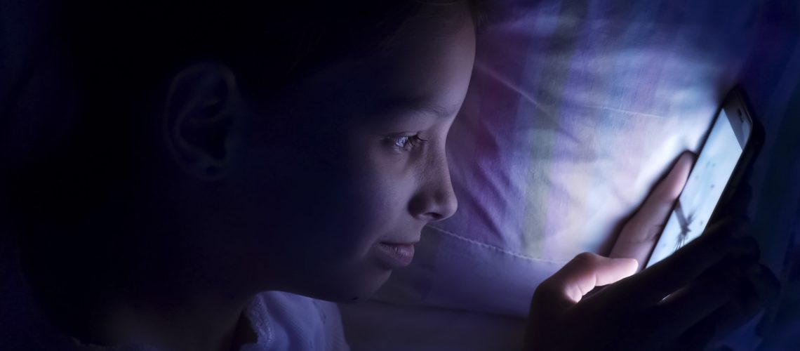 digital modern device addiction. gadget night sleeplessness. young caucasian girl browsing chatting playing serfing network with tablet bed. mobile phone apps.
