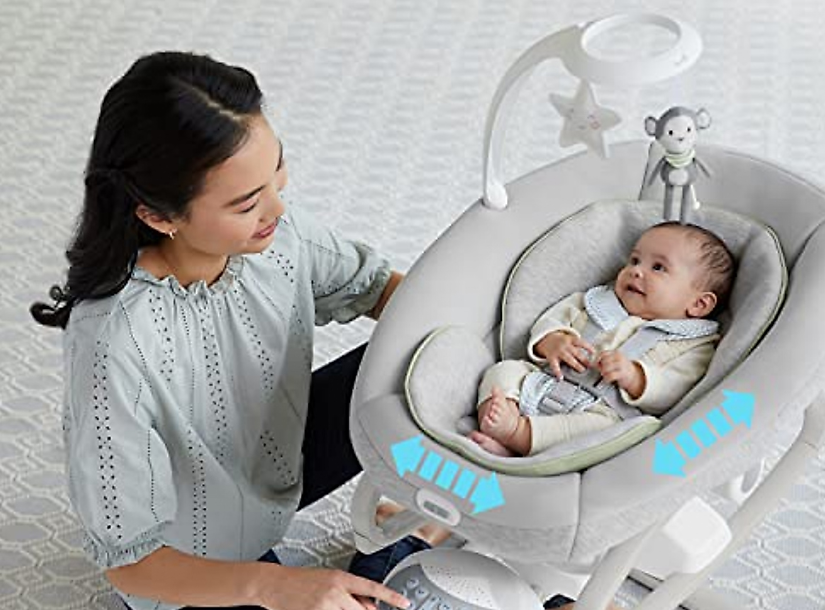 A parent gently rocking a baby to sleep as part of a calming bedtime routine
